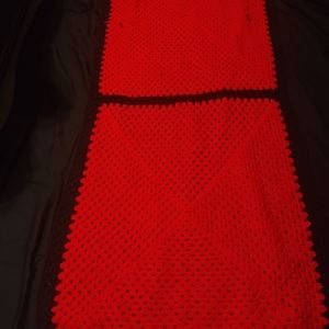 Back and red afghan throw
